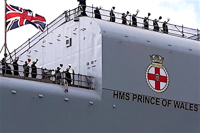 The crew of HMS PRINCE OF WALES give a ‘hip, hip, hooray.’