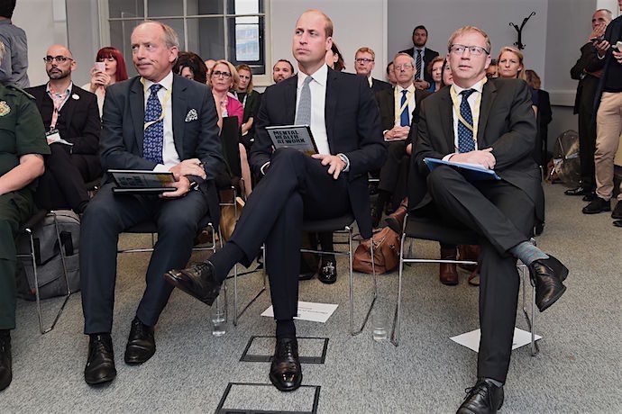 HRH observes a demonstration of the resource materials available for employers and their staff on mental health in the workplace