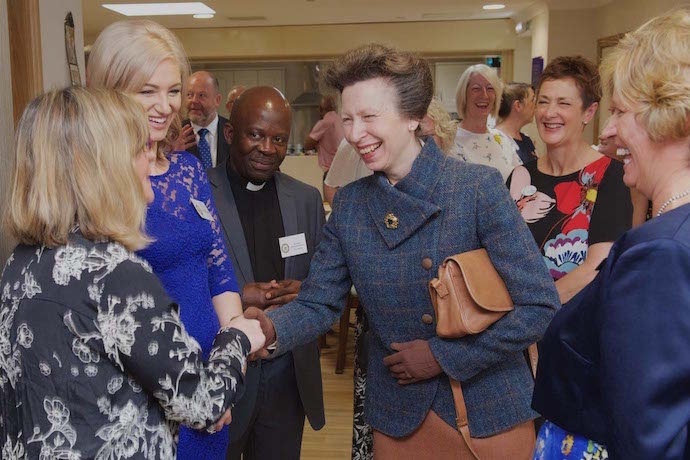 HRH shares a light moment with staff working at Griffiths House.