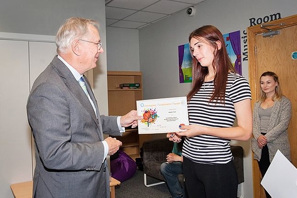 HRH presents a pre-apprenticeship in construction certificate to Ms Sophie Frost at 1625ip.